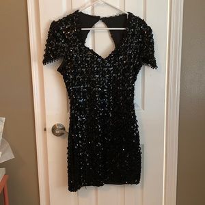 Black sequined stretchy dress with keyhole back. Size 8. Like new.
